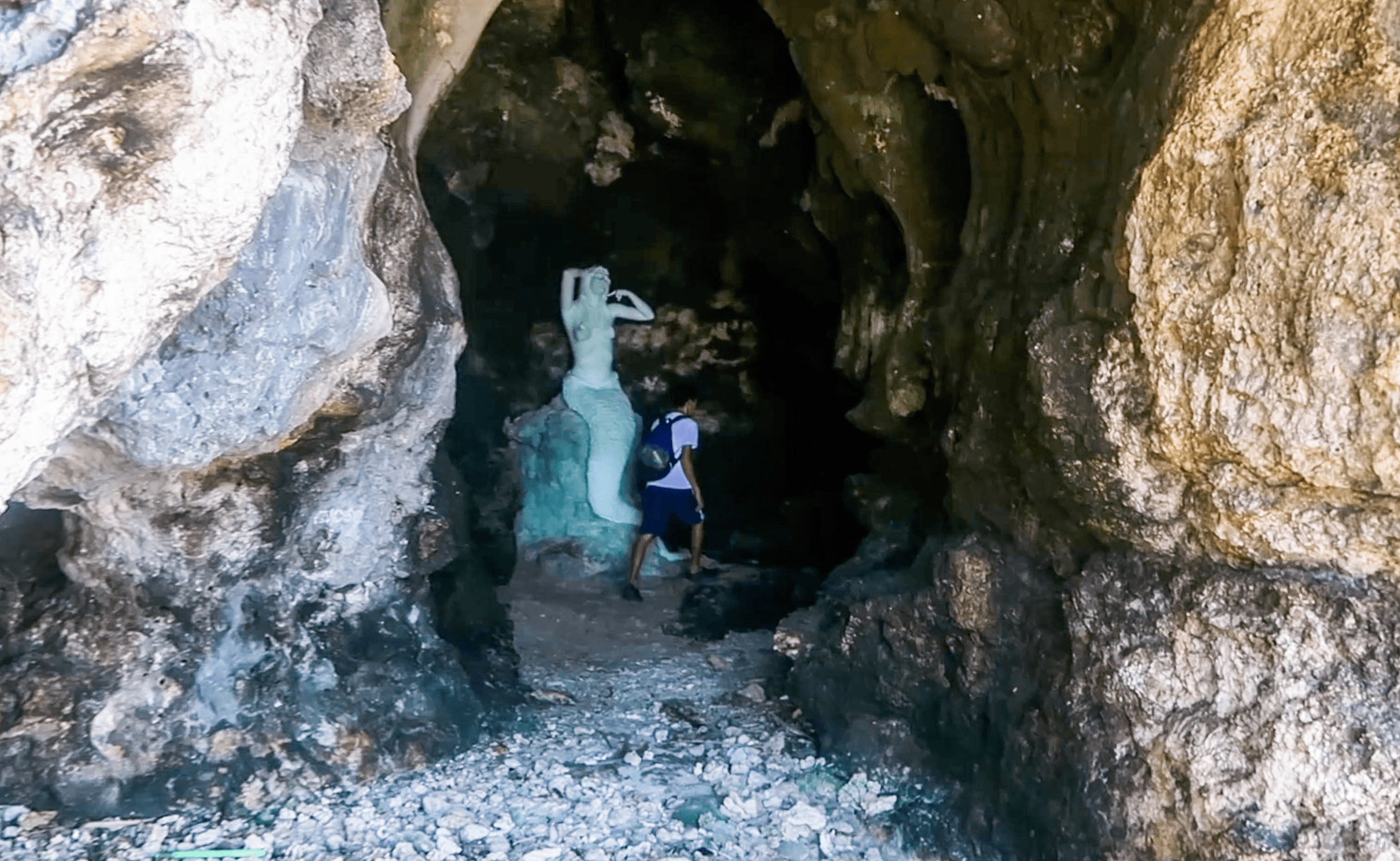 statue of a mermaid in a cave at hundred islands pangasinan philippines